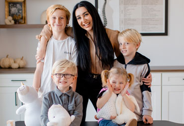 an office team stretching in office together