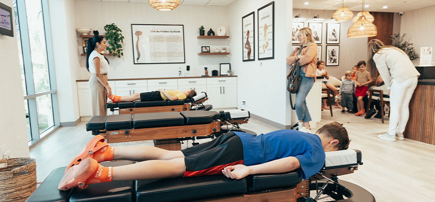 chiropractor discussing spine misalignments with patient