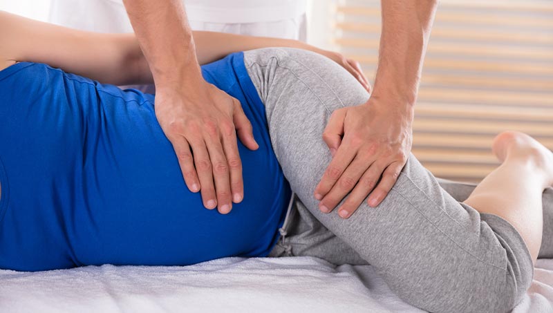 pregnant woman getting adjusted at San Clemente
